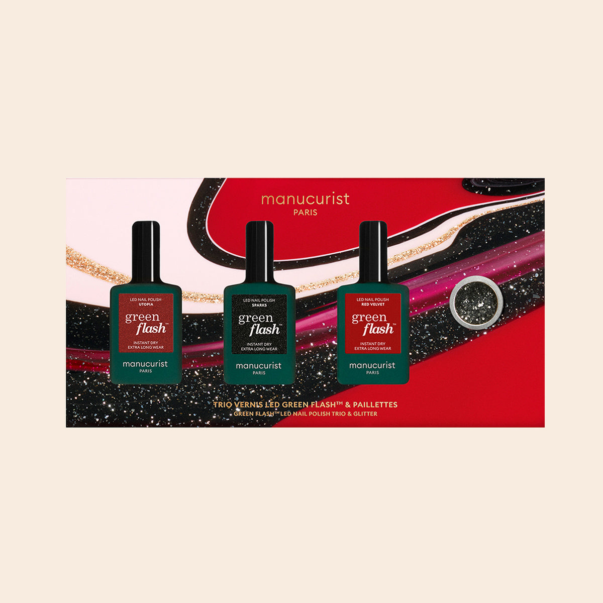 The Manucurist-test Midnight Glam Trio + Glitter Set features three Green Flash nail polishes in a colorful gift box with abstract swirl designs and biodegradable glitter.