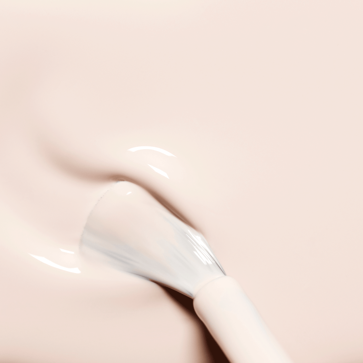 A brush applies Manucurist Crème, a milky pale pink gel nail polish, onto nails for a smooth, glossy finish with subtle swirls and a reflective sheen.
