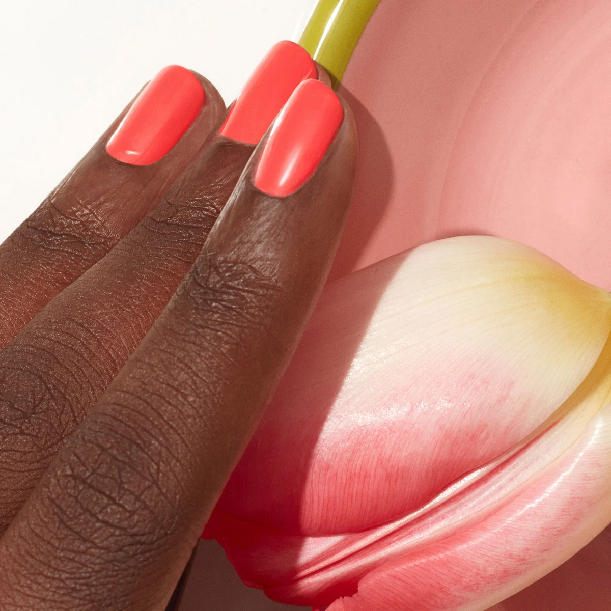 A hand with dark skin wears Manucurist&