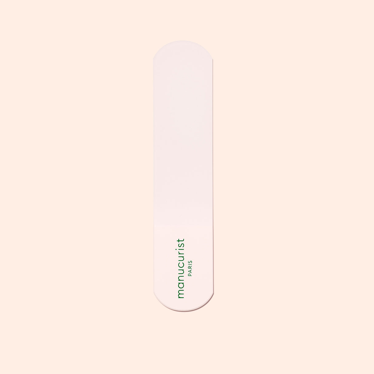 A single pink nail file with rounded ends and the green Manucurist-us logo, ideal for pairing with the Manucurist-us Glass Foot File to exfoliate heels and achieve soft, smooth skin.