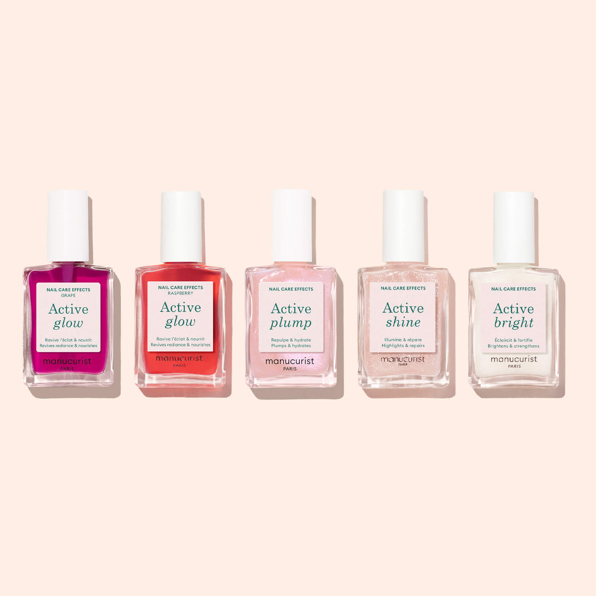 Cinq flacons de soins des ongles Manucurist sont alignés sur un fond rose clair, chacun portant une étiquette indiquant différents effets, dont la formule Active™ Glow Grape. Parfaites pour votre routine de soins des ongles, ces formules Manucurist apportent un éclat et une brillance naturels, tandis qu’Active™ Glow Grape offre une fraîche touche de lilas rappelant un vernis à ongles fraîchement appliqué.