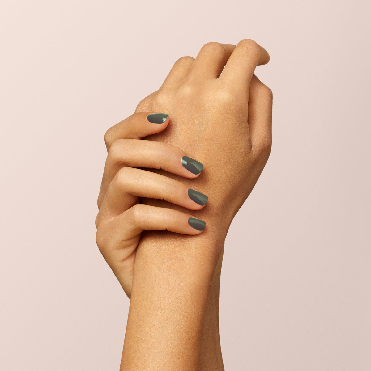 Hands with neatly manicured nails painted in Manucurist&
