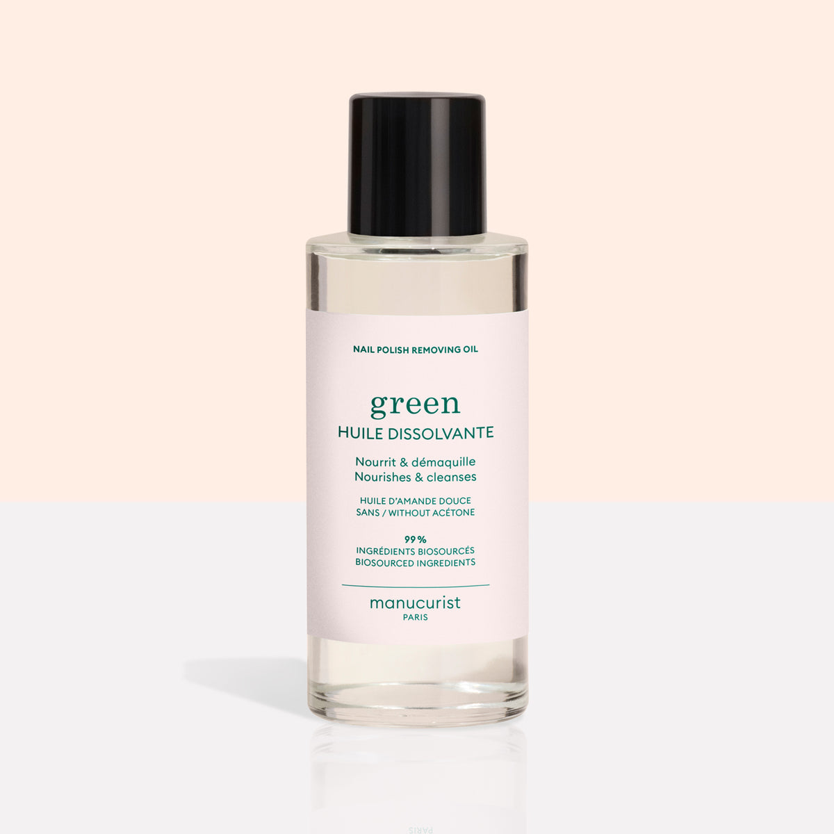 A clear bottle from the Manucurist Green™ Base, Top Coat  Nail Polish Remover Trio, featuring a black cap and pale pink label, is displayed on a light background—perfect for effectively removing even the most stubborn green nail polish or gel-effect manicure.