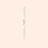 The Manucurist Glass Cuticle Pusher features a pointed tip and beveled edge for precise nail contouring, with "manucurist" in green on a white center section, displayed on a light beige background.