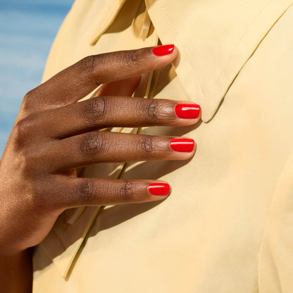 A close-up of a hand with neatly manicured nails painted in Manucurist&