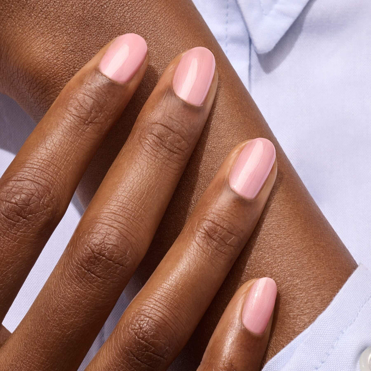 A close-up of a hand with neatly manicured nails painted in Manucurist&