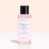 A pink bottle from the Manucurist Green™ Base, Top Coat  Nail Polish Remover Trio with a black cap is displayed against a light background. Perfect for removing Green nail polish or refreshing your gel-effect manicure, its label displays details in both French and English.