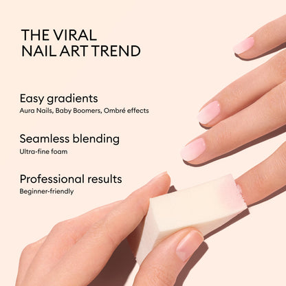 Une main utilise les Nail Art Sponges Manucurist (x4) pour dégrader harmonieusement vernis rose et blanc, créant un Baby Boomer impeccable. Le texte met en avant cette tendance Nail Art virale, une application facile et un rendu pro, même pour les débutants.