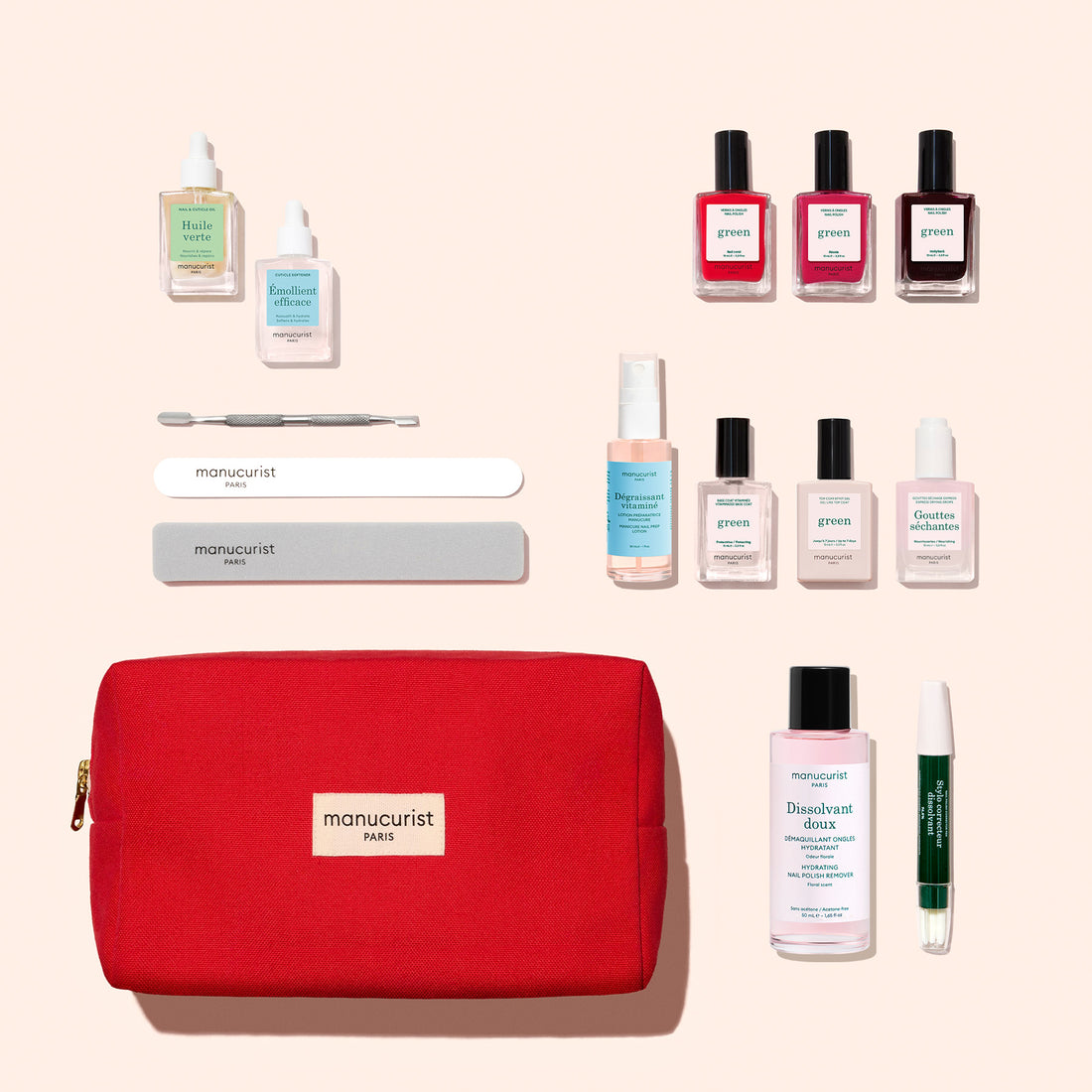 The Green™ Ultimate Kit features three bottles of colored polish, various nail treatments, oil and remover, a nail file, a cuticle pusher, and a red zippered carrying pouch.
