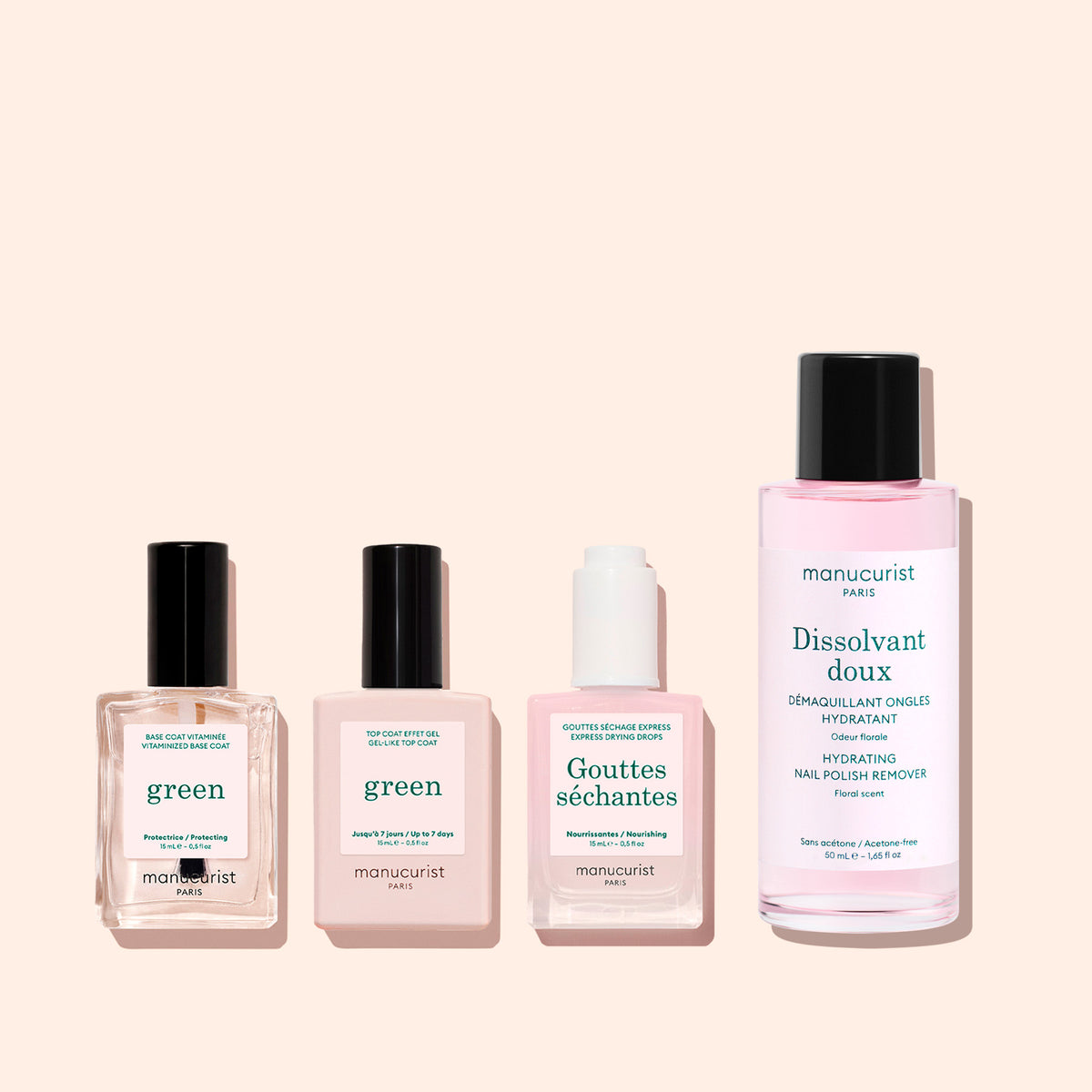 Four manicure products with pink and white labels stand side by side on a pale pink background, including nail polish, Manucurist&