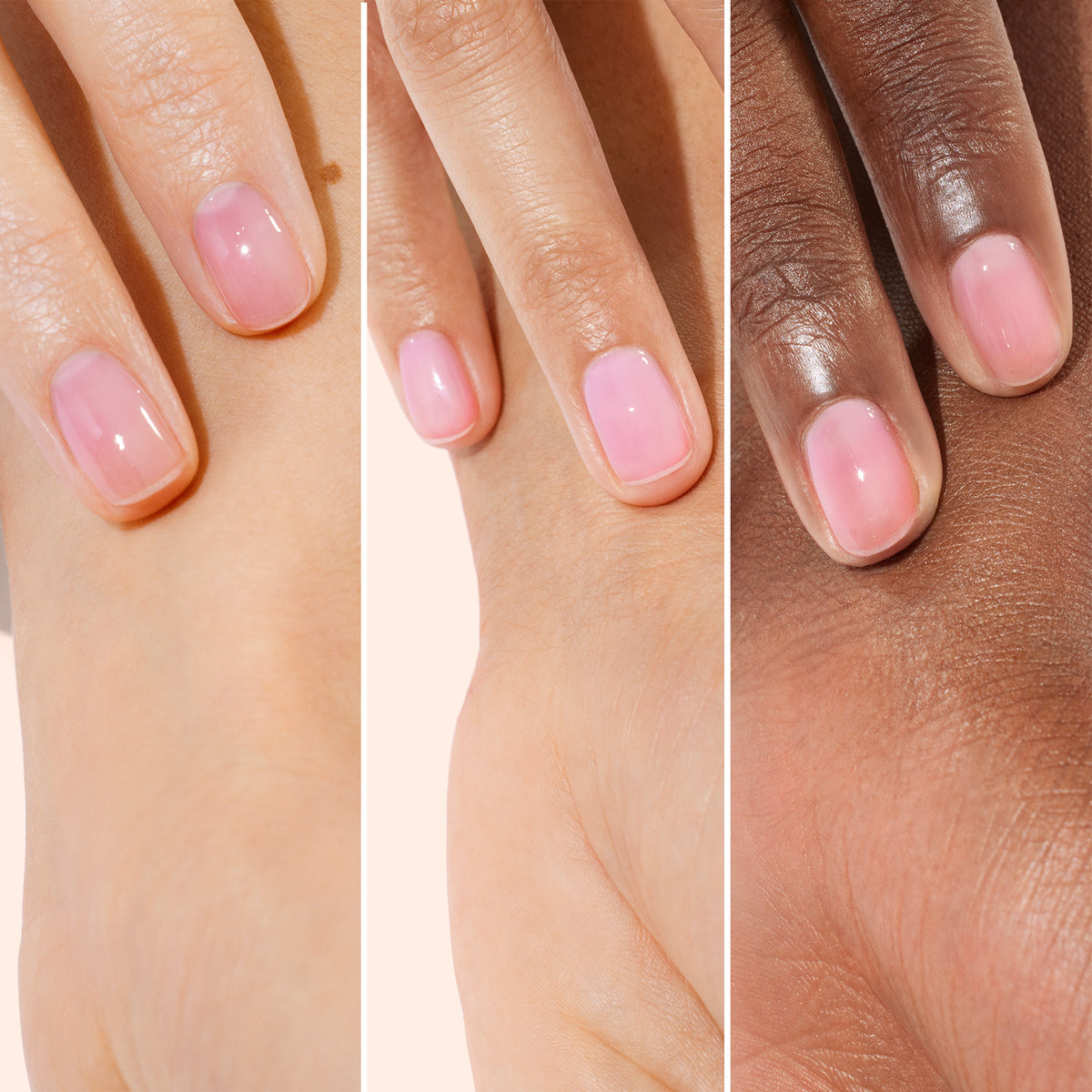 Three hands with different skin tones, each displaying natural-looking nails with a glossy light pink finish, are shown side by side on a neutral background—showcasing the results of Manucurist’s Active™ Glow Blueberry nourishing plant-based nail care and effective nail enhancer.