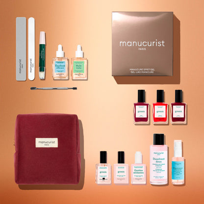 Introducing the Manucurist Green™ Ultimate Kit Gift Set: a curated collection of manicure essentials for perfecting your at-home manicure. This boxed set features nail files, nourishing serums, naturally derived nail polishes, bottles of base and top coats, and a luxurious red velvet pouch—all beautifully presented on a peach-colored background.