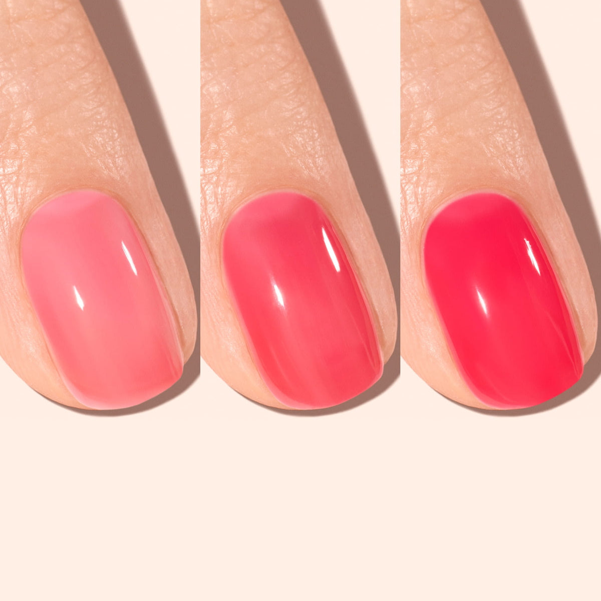 A close-up of a finger shows three nails side by side, each painted with a pink polish in gradually increasing intensity from light pink on the left to vibrant pink on the right.