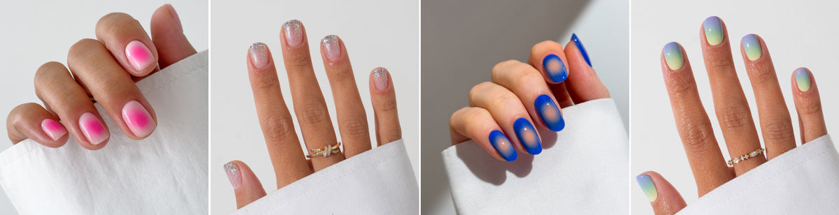 Four hands display different manicures: pink gradient nails, clear nails with silver glitter tips, matte blue nails with lighter centers, and pastel nails with a soft gradient. All hands wear gold rings and hold white fabric.