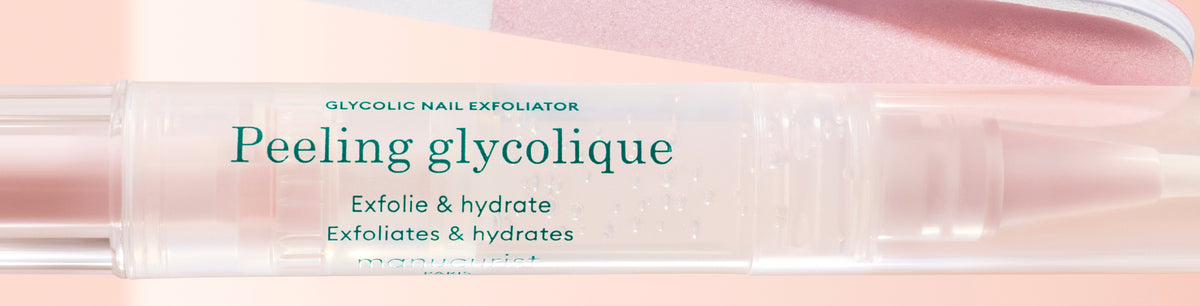 A close-up of a transparent pen-like tube labeled Peeling glycolique with text indicating it is a glycolic nail exfoliator that exfoliates and hydrates. The background is soft pink and peach.