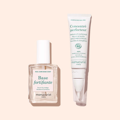 A clear bottle of Manucurist Force Nail Hardener and a white nourishing nail pen are displayed on a light beige background.