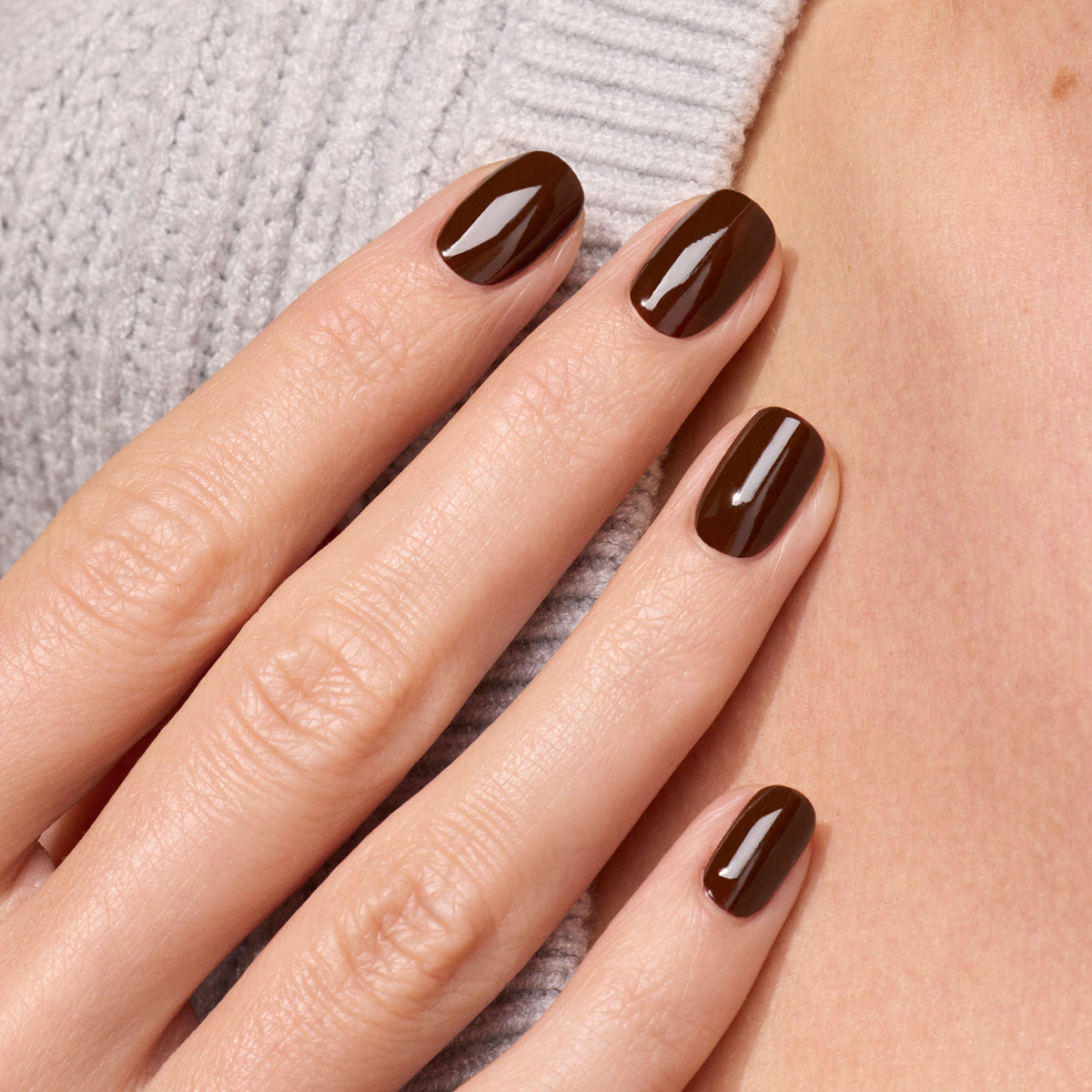 A close-up of a hand with neatly manicured nails painted in Manucurist&
