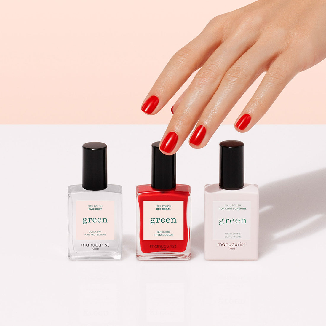 A hand with neatly manicured red nails reaches for Manucurist&