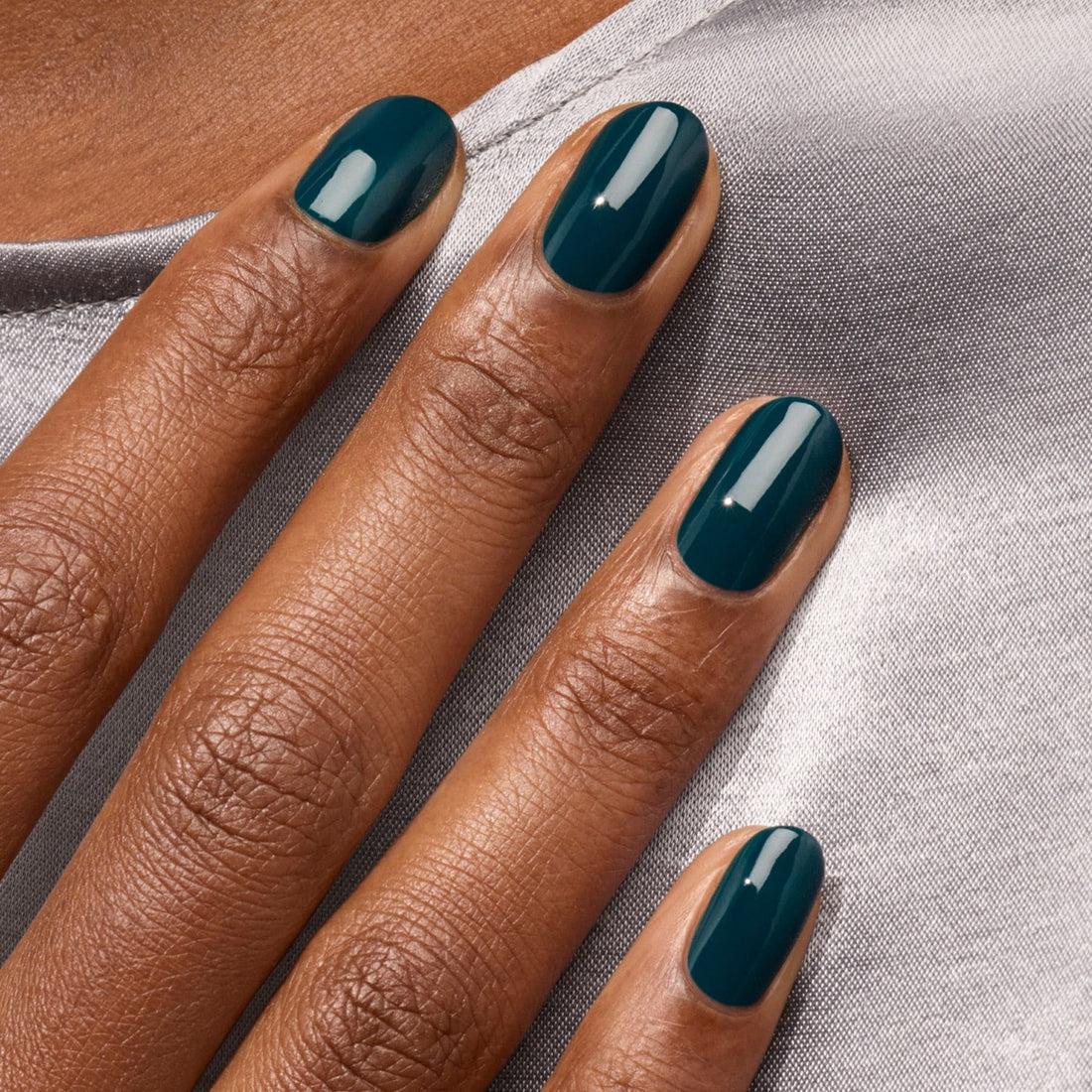 A close-up of a hand with neatly manicured nails painted in Manucurist&