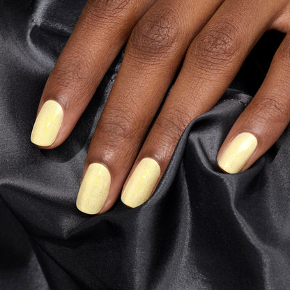 A hand with neatly manicured nails painted in Manucurist&