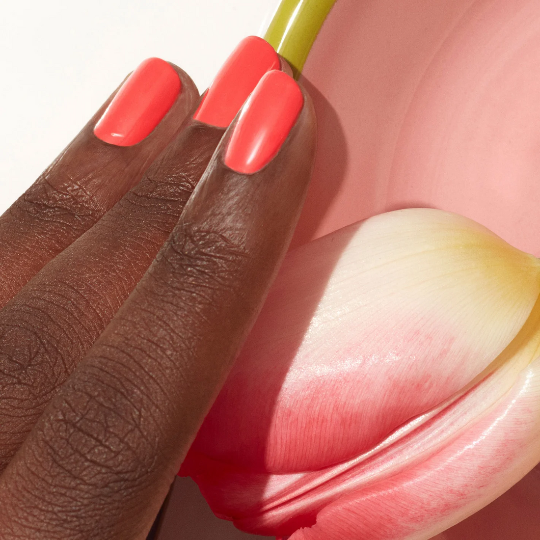 A hand with dark skin wears Manucurist&