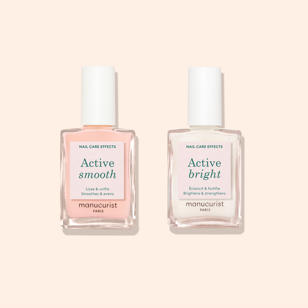 Manucurist’s Active™ Duo includes two glass bottles of nail care—Active Smooth and Active Bright—with white caps and minimalist beige labels. Perfect for natural nails.