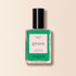A clear glass bottle of Manucurist Brazil nail polish in electric green with a black cap. The label says Brazil, green, Quick Dry Intense Color, semi-matte finish by Manucurist Paris on a pink and green background. Perfect with your favorite Top Coat.