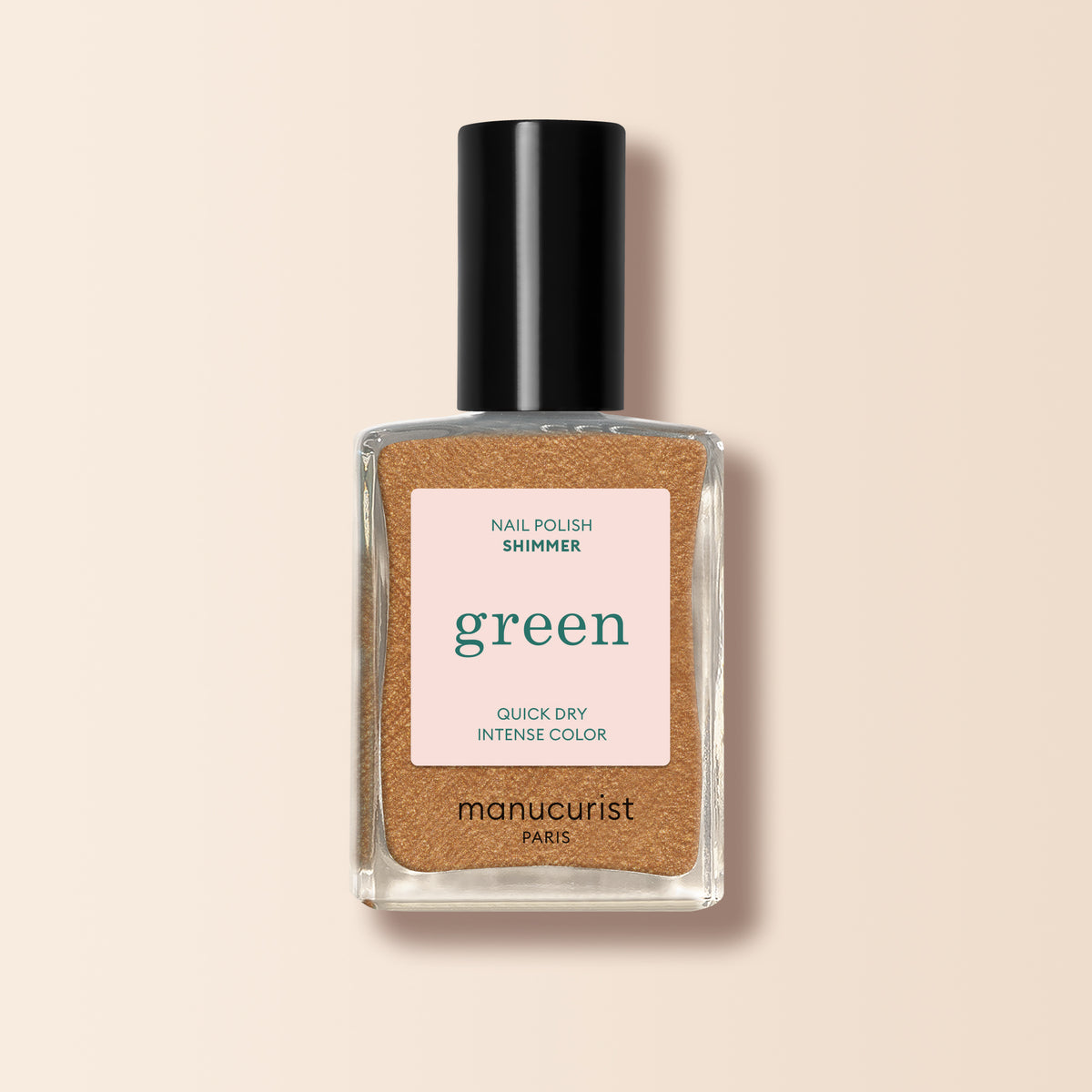 A clear glass bottle of Manucurist Shimmer nail polish features a honey-glazed bronze shade with shimmer, quick-dry formula, and intense color, topped with a black cap.