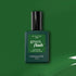 A bottle of Manucurist Jade Green Flash LED nail polish sits against a green backdrop, with a glossy green paint streak in the lower right corner.