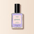 Un flacon de vernis Manucurist Wisteria, une teinte violet pastel aux sous-tons bleu froid avec capuchon noir, présenté sur fond beige clair. L&