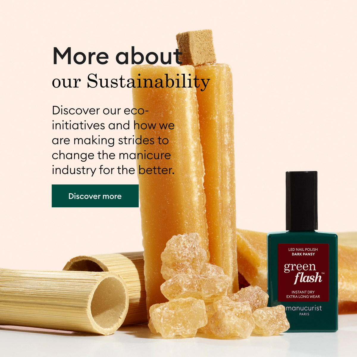 A green nail polish bottle stands next to honey-colored crystals, cylindrical bamboo pieces, and a brown translucent stick, with text about sustainability and eco-initiatives in the manicure industry.