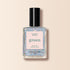 A bottle of Manucurist nail polish in the shade Mermaid with a black cap and clear base filled with iridescent glitter is displayed against a pale beige background.