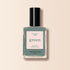 A bottle of Manucurist nail polish in the shade Sage, with a black cap and a label reading "green, quick dry intense color," is shown against a light beige background.