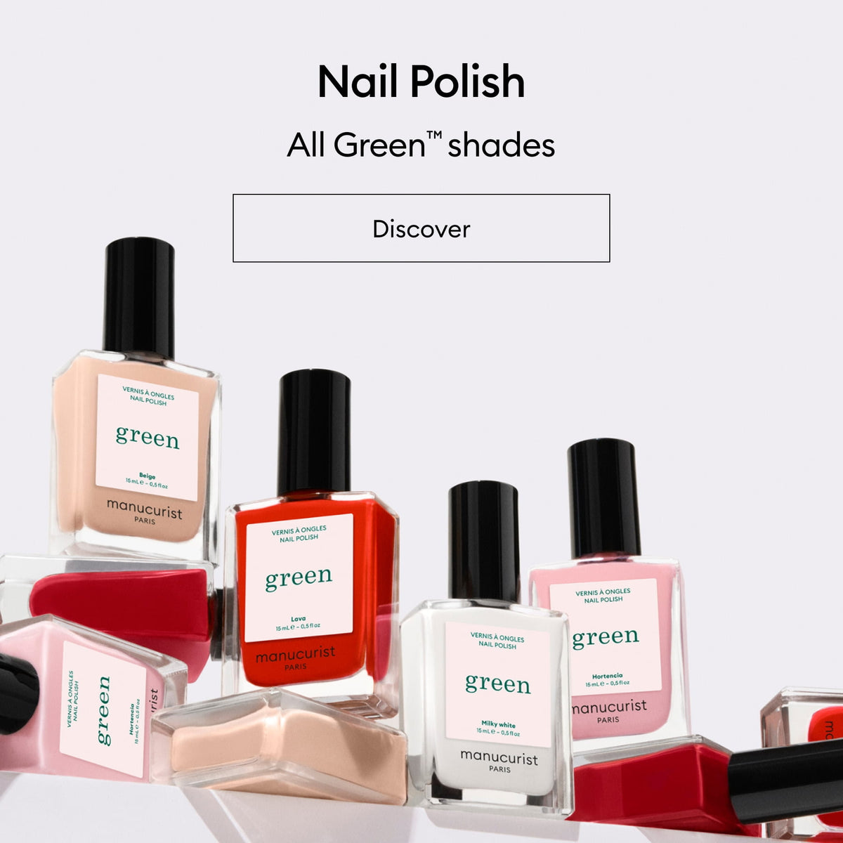 Bottles of Manucurist Paris nail polish in various colors and labeled green are arranged on a white background with the text Nail Polish - All Green shades - Discover above them.