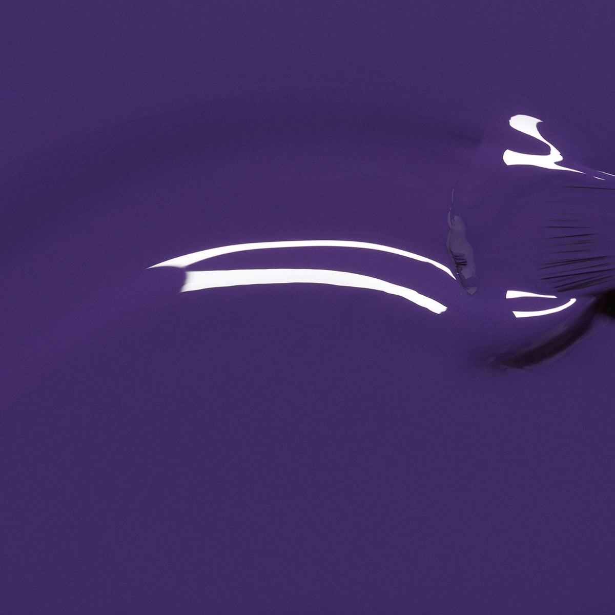Manucurist Mystic nail polish delivers a glossy, intensely pigmented deep blue-violet finish with a curved light reflection and a subtle brush mark on the right side.
