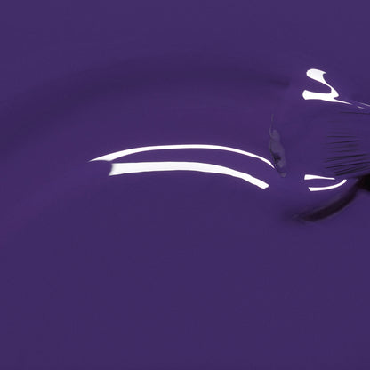 Manucurist Mystic nail polish delivers a glossy, intensely pigmented deep blue-violet finish with a curved light reflection and a subtle brush mark on the right side.