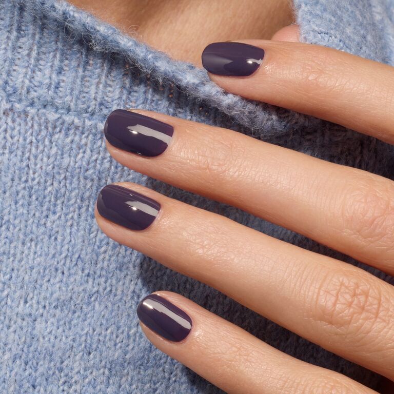 A close-up of a hand with neatly manicured nails painted in Manucurist&