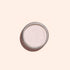 A round metal container of Manucurist Pink Glazed Effect Powder, featuring a subtle pearlescent sheen, is viewed from above against a light beige background.