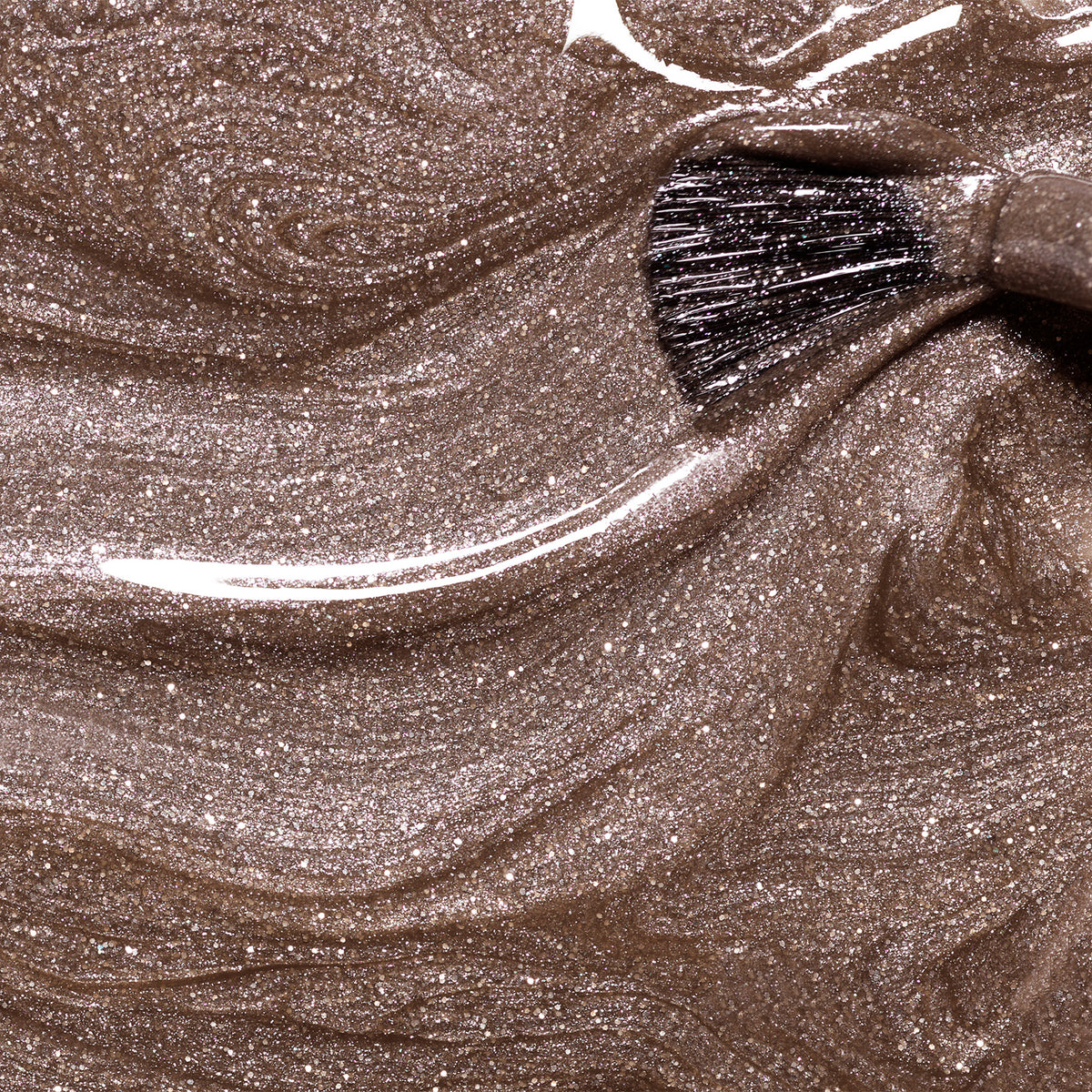 A close-up of a brush swirling through Manucurist&