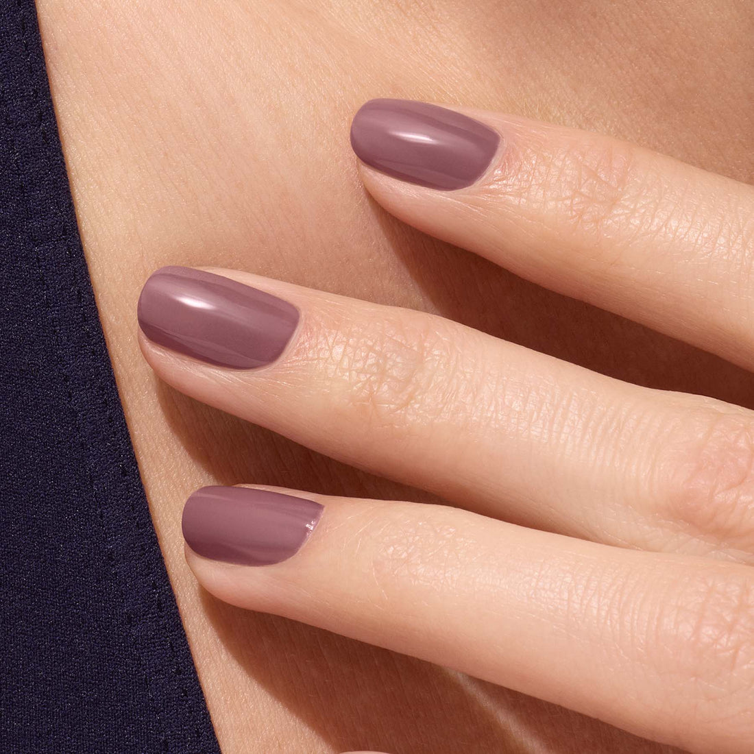 A close-up of a hand with neatly manicured nails painted in Manucurist&