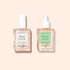 Le duo S.O.S Rescue de Manucurist comprend deux flacons carrés en verre — Base S.O.S. avec un bouchon blanc et Huile Verte avec une pipette — idéal pour restaurer les ongles abîmés après des manucures au gel.