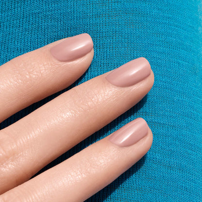 Three neatly manicured fingers showcase Manucurist&