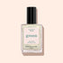 A bottle of Manucurist Solar nail polish in a shimmery pale shade with golden shimmer, black cap, and label reading "Nail Polish Solar, Quick Dry Intense Color" on a light pink background.