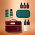 A flat lay of the Manucurist Green Flash™ Starter Kit Gift Set, featuring nail polish bottles, remover, green-capped accessories, a teal nail lamp, nail files, and tweezers—all arranged beside a burgundy zippered pouch on a gradient peach background—perfect for achieving salon-quality manicures at home.