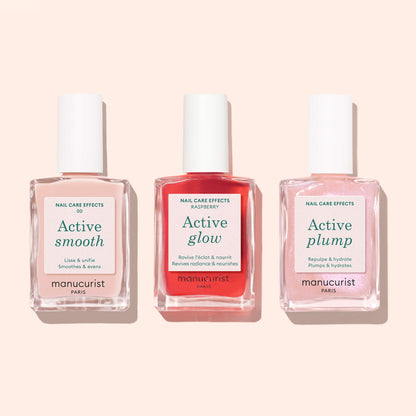 Three bottles of Manucurist Active™ nail care polish—Active™ Smooth 00, Active™ Glow, and Active™ Plump—are displayed side by side on a light background, showcasing their plant-based formula designed for effective nail treatment.