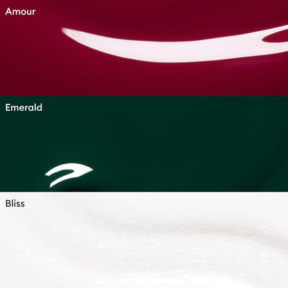 Three horizontal sections display close-ups of Manucurist Green Flash gel polishes from the Customizable Trio: a deep red shade labeled Amour, a dark green labeled Emerald, and a shimmery white labeled Bliss. Each section showcases a streak of glossy Green Flash gel polish, highlighting vibrant color payoff and shine—all easily removed with your favorite nail polish remover.