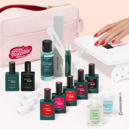 The Manucurist Super Ultimate Kit includes Green Flash gel polishes, nail care essentials, manicure tools, a vitaminized base coat, and a pink pouch. Achieve ultra-glossy red nails using the white LED nail lamp.