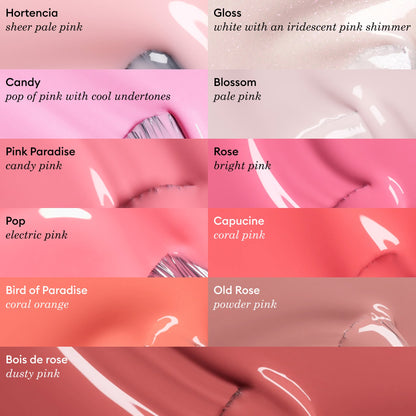 Image of ten Manucurist Green™ nail polish swatches, including "Bird of Paradise," featuring sheer pale pink, shimmering pink, coral orange, and dusty rose shades—each labeled with its name and description.