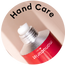 A close-up of an open red tube of cream with Hand Care written above it in black text on a light background.