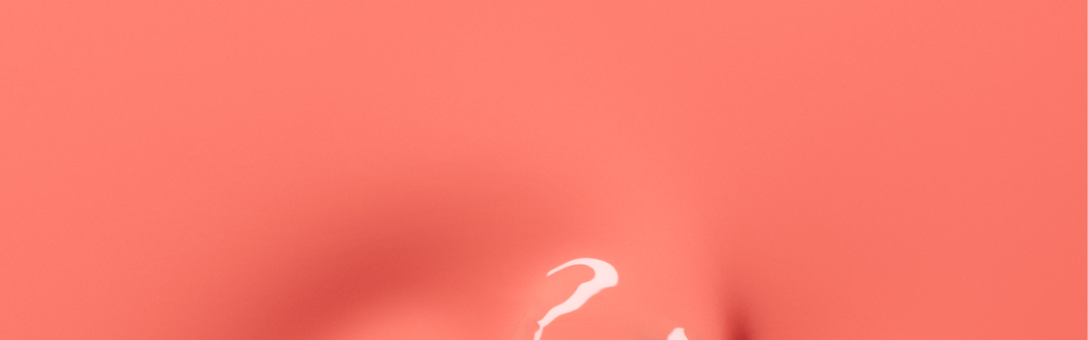 A soft coral pink background with subtle shadows and a small, white, abstract curved line near the bottom center.